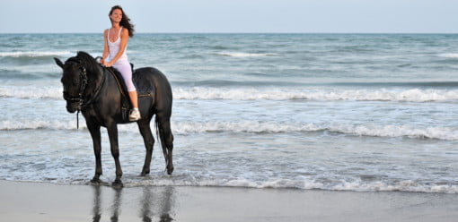 riding girl on a beach
